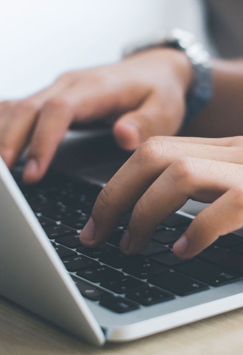 Blurred selective focus, Male hand with piggy bank calculating on financial, tax and business financial spreadsheet. Tax and expense cost saving for personal and enterprise corporate concept.